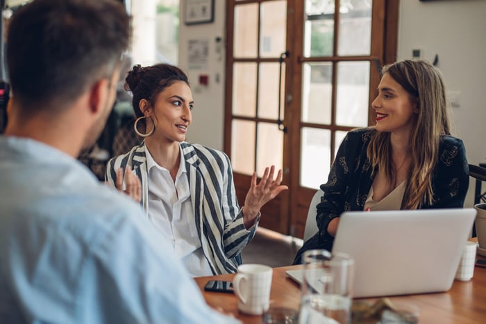 people discussing diversity and inclusion coaching